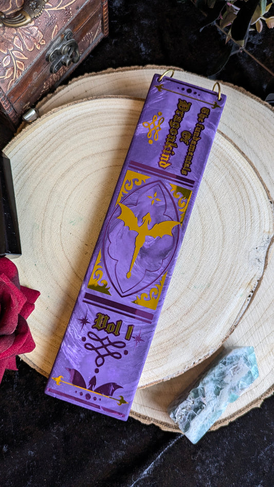 The Fundamentals of Dragonkind Book Spine Wall Hanging